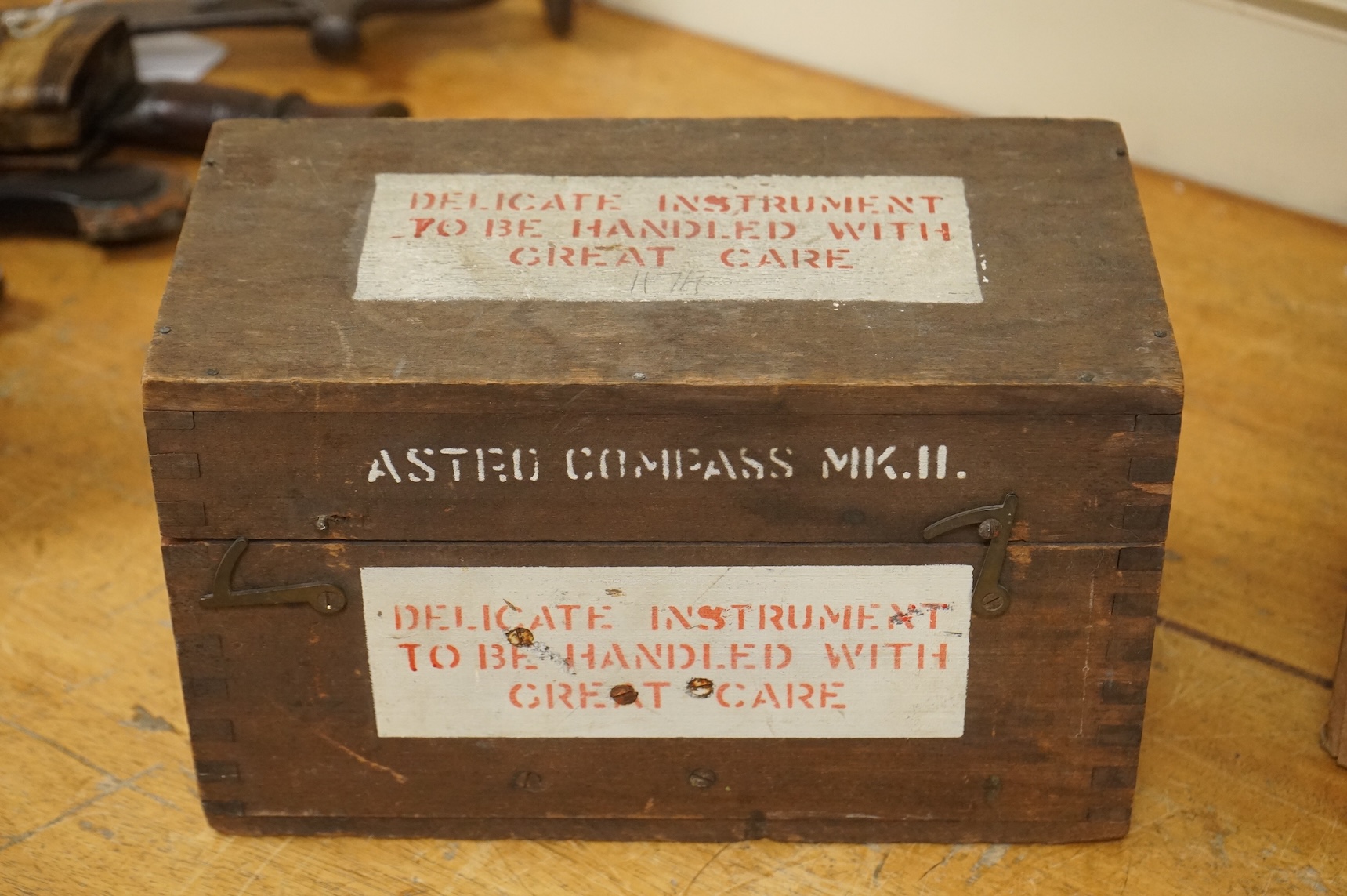 A WWII cased RAF Air Ministry Astro Compass MKII, the inside lid of the case stamped examined 24 March 1943, case dimensions 16.5cm wide, 16cm high, 13.5cm deep